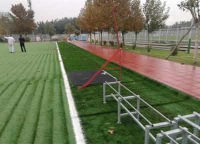 انجام فعالیت های پایانی تعویض چمن مصنوعی مرکز ملی فوتبال